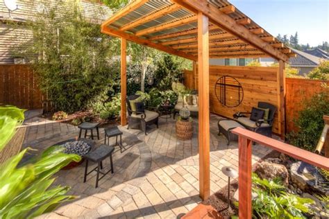 japanese style backyard with rustic pergola and bamboo fountain