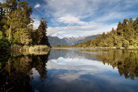 Lake Matheson And The Southern Alps Photograph by Simonbradfield | Fine ...