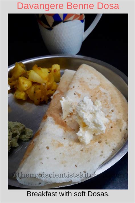 a silver plate topped with food next to a cup