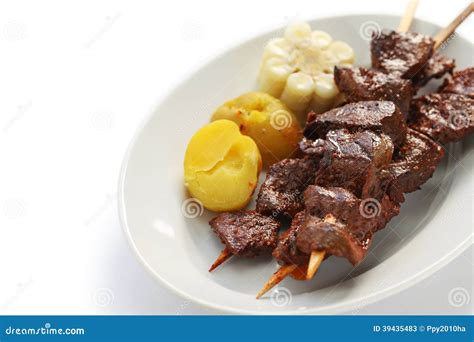 Anticuchos, Peruvian Cuisine, Grilled Skewered Beef Heart Meat With Boiled Potato And Aji Sauce ...