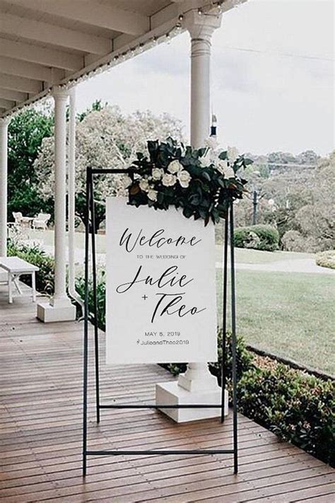 romantic beach wedding ceremony welcome sign with green and white ...