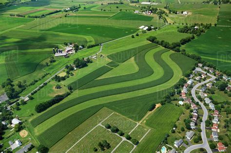 Agriculture - Aerial view of farmsteads and fields utilizing strip ...