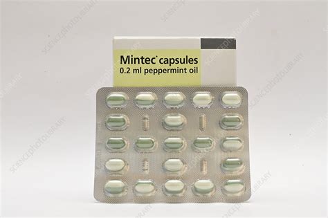 Peppermint oil capsules and packaging - Stock Image - C051/1180 - Science Photo Library