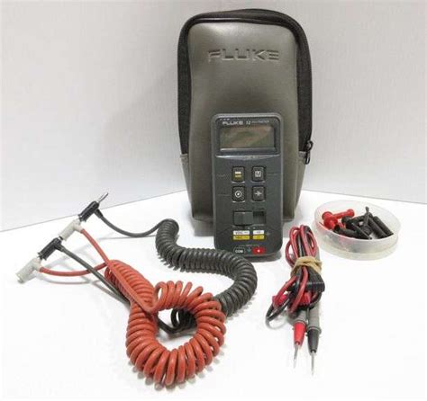 Fluke 12 multimeter with (2) sets of test leads, accessories, and new battery - Albrecht Auction ...