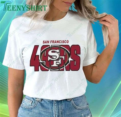 a woman wearing a san francisco shirt with the number forty's in red ...