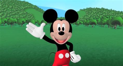 a cartoon mickey mouse waving at the camera with trees in the backgrouds