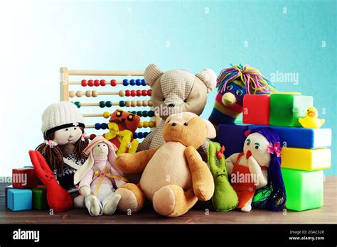 Pile of toys on blue background Stock Photo - Alamy