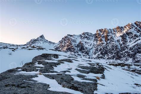 Sunlight on snowy range with blue sky in Lofoten islands 5733043 Stock Photo at Vecteezy