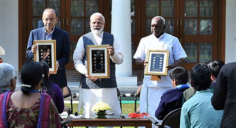 The Prime Minister, Shri Narendra Modi releasing the new series of visually impaired friendly ...