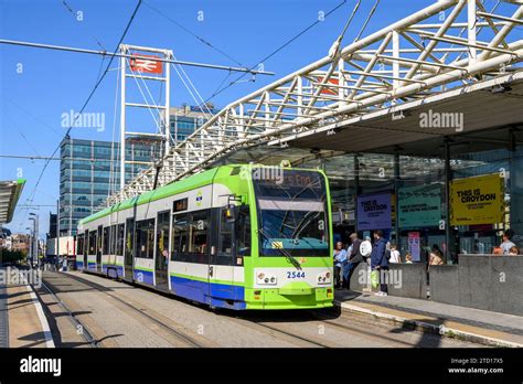 London Trams tram waiting at a stop outside East Croydon railway station, Croydon, England Stock ...