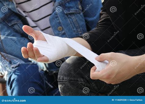 Bandaging Injured Hand after an Accident, First Aid Stock Photo - Image of health, bandaged ...