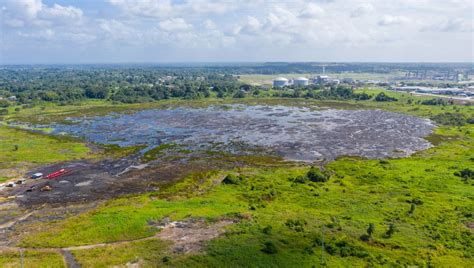 The Caribbean's Pitch Lake Is So Sticky You Can Walk Across It | IFLScience