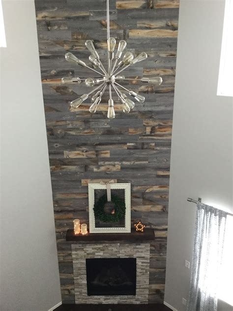 An 18' Stikwood fireplace accent wall! | Fireplace accent walls, Home fireplace, Weathered wood