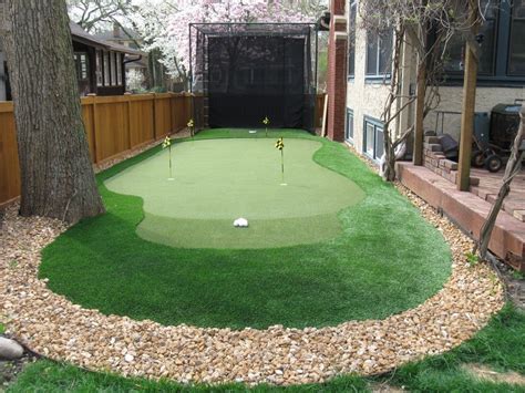 Traditional Landscape/Yard with Backyard Golf Cage, Fence, Dave Pelz ...