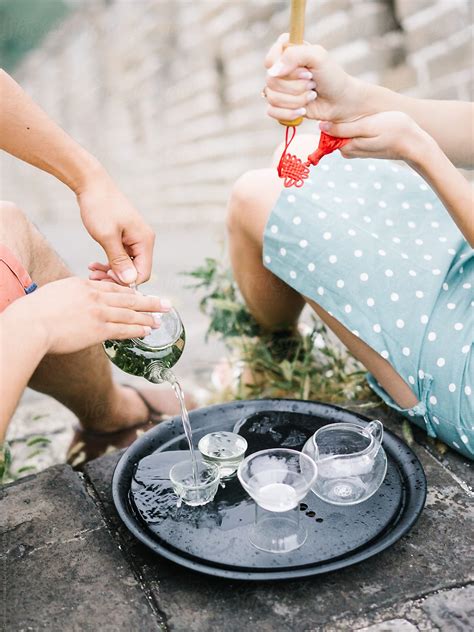 "Couple Pouring Tea On Ceremony" by Stocksy Contributor "Dreamwood ...