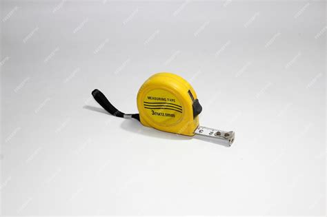 Premium Photo | Yellow construction tape measure isolated on white background