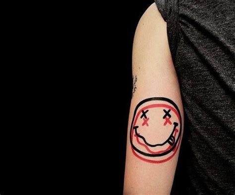 Image result for nirvana smiley face tattoo | Nirvana tattoo, Tattoo designs men, Tattoo designs