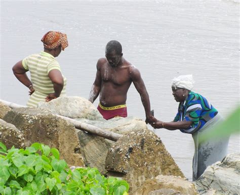 Cleansing Ritual | Two women preside over this man's ritual … | Flickr