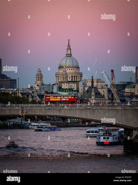 The London skyline with a pink sky Stock Photo - Alamy