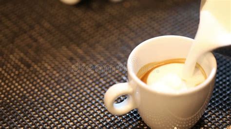 4k, Barista Pouring Milk into Espresso Coffee for Making Cappuccino, Latte Art, Slow Motion ...