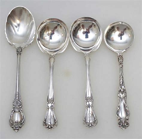 4 ANTIQUE STERLING SILVER SPOONS