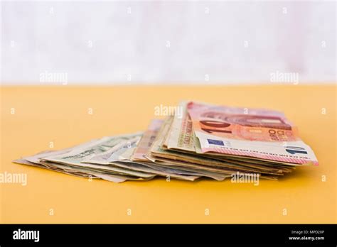 Paper money and coins of the different countries Stock Photo - Alamy