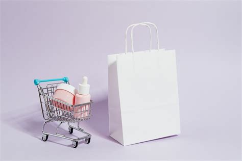 Shopping Cart Next to a White Paper Bag · Free Stock Photo