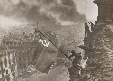 Yevgeny Khaldei | Raising the Soviet Flag over the Reichstag Building, Berlin | MutualArt