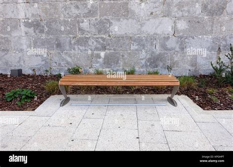 Empty park bench Stock Photo - Alamy