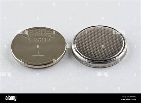 A CR2025 button cell lithium battery isolated Stock Photo - Alamy