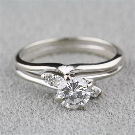 Pre-Owned Diamond Engagement Ring with 14 Karat White Gold Wedding Band