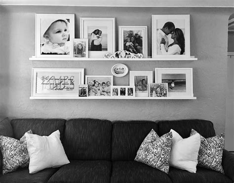 Family room gallery wall. Recycled old frames, spray painted them white and used black and whi ...