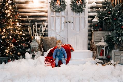 Premium Photo | Beautiful little boy on a Christmas decor