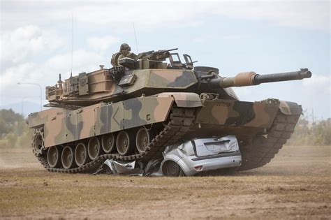 September 2021. Australian Army M1A1 Abrams AIM tank vs car at Lavarack Barracks, Townsville ...