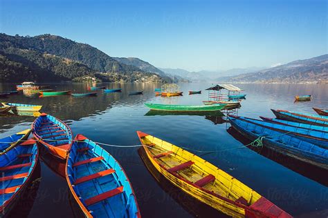 "The Boats In The Phewa Lake ,Pokhara" by Stocksy Contributor "Zheng Long" - Stocksy