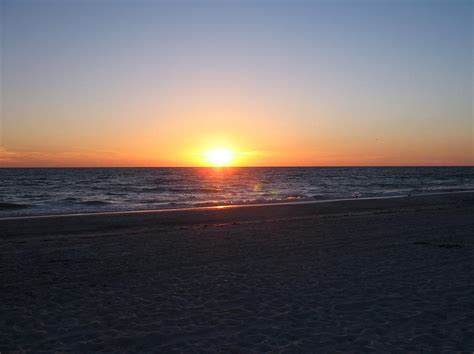 Walking The Sandy Beach At Sunset Photograph by Deb Breton