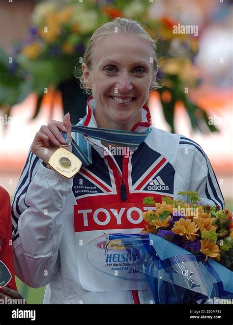 Great Britain's Paula Radcliffe shows off her gold medal for the ...