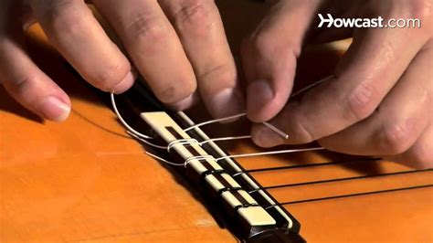 How to Restring a Nylon String Guitar | Guitar Lessons - YouTube