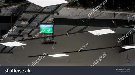 Illuminated Green Emergency Fire Exit Sign Stock Photo 1325274095 ...