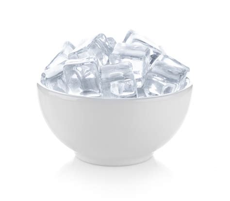 Premium Photo | Ice cubes in the bowl on white space.