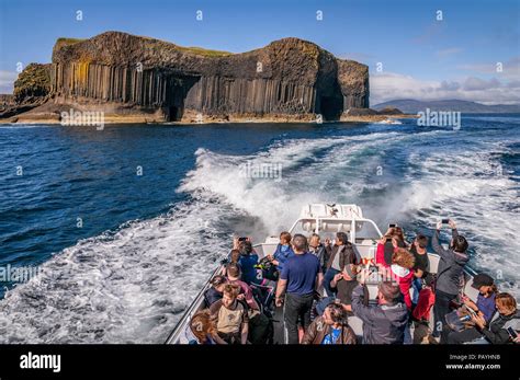 The island of Staffa and Fingals cave. Boat Cave on the left. Argyll ...