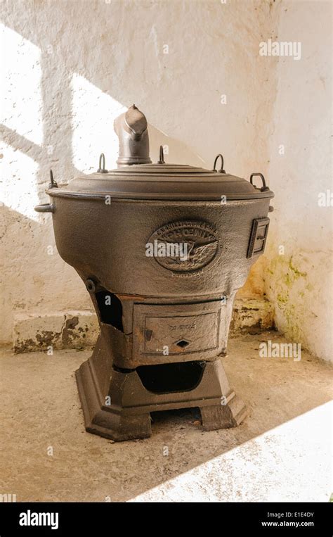 An old cast iron furnace used to heat industrial and agricultural ...