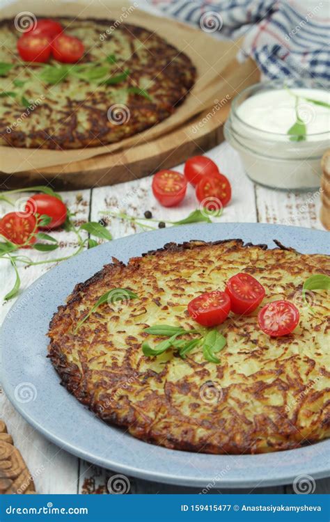 Rosti - Swiss Dish Made of Grated Potato Stock Image - Image of dish ...