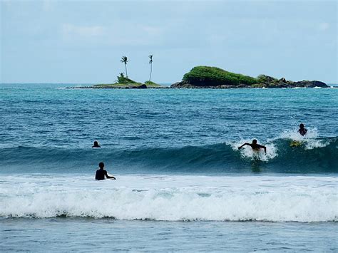 Image: Surfers Surfing at Busua Beach in Western region, Ghana