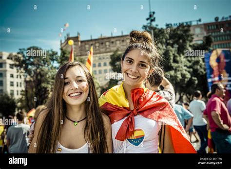 Barcelona, Spain. 12th October, 2014. Two girls with Spanish flags and ...