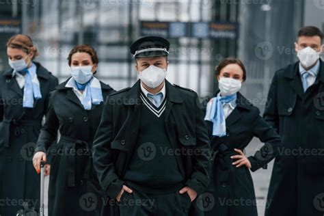 Aircraft crew in work uniform is together outdoors in the airport 15458314 Stock Photo at Vecteezy