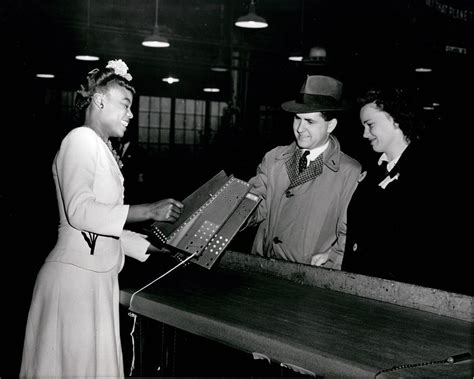 Curtiss-Wright employee demonstrating a part at Curtiss-Wright Family Day, 7 November 1943 ...