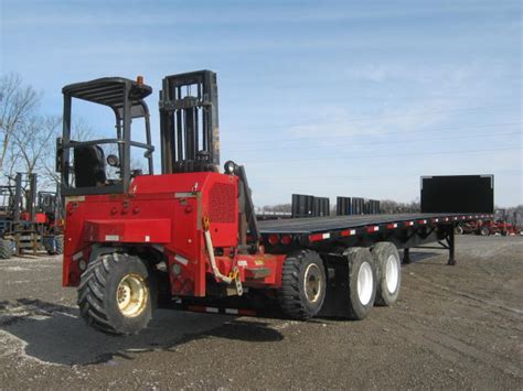 Flatbed Trailer With Piggyback Forklift | Equipment Remarketing Blog