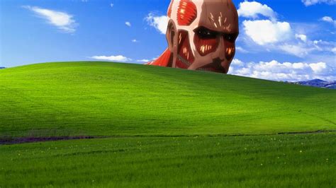 an alien head in the middle of a green field with blue skies and white clouds