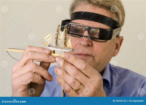 Ship in a bottle builder stock photo. Image of magnifyingglasses - 29243722